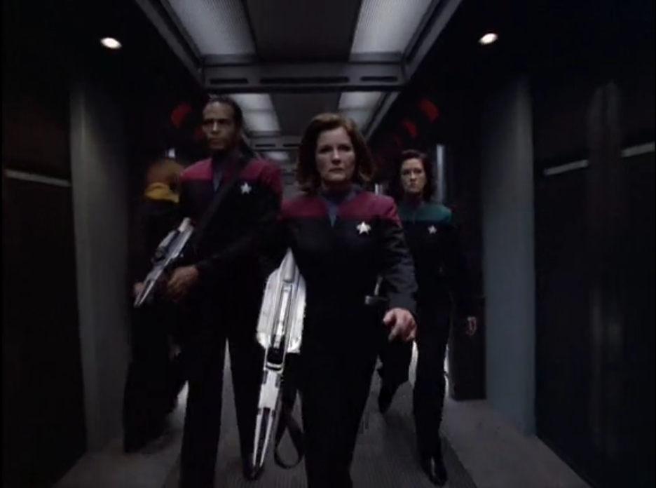 The meme is a screenshot from the TV show Star Trek: Deep Space Nine, featuring the character Kira Nerss' stern expression as she walks down a corridor. The image is captioned "When you're trying to be professional but you just had to deal with 3 hours of meetings with the department of redundancy in personnel."